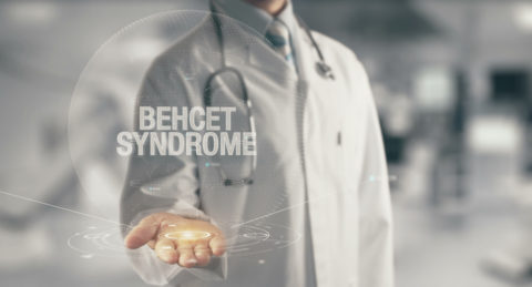 Doctor holding in hand Behcet Syndrome