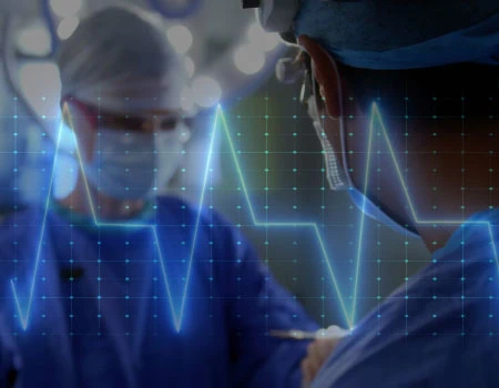 Surgeons in blue scrubs and masks operating in a theatre, overlaid with a glowing ECG heartbeat trace.